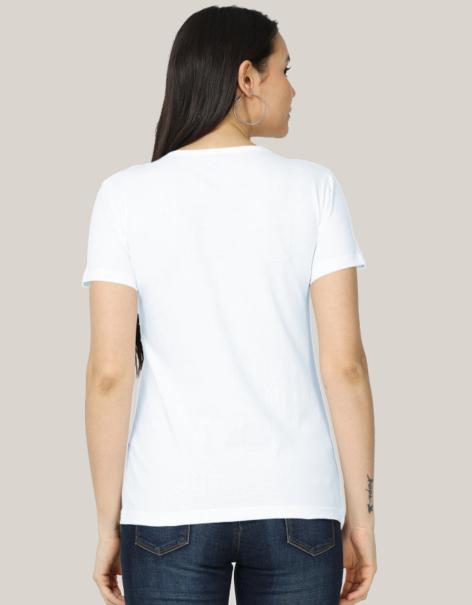 The Not In a Row Classic T-Shirt by A Heartee Affair is a white, 100% cotton tee featuring orange cartoon ducks and “Definitely not all in a row,” surrounded by stars, styled with denim shorts, sunglasses, jewelry, and coffee.